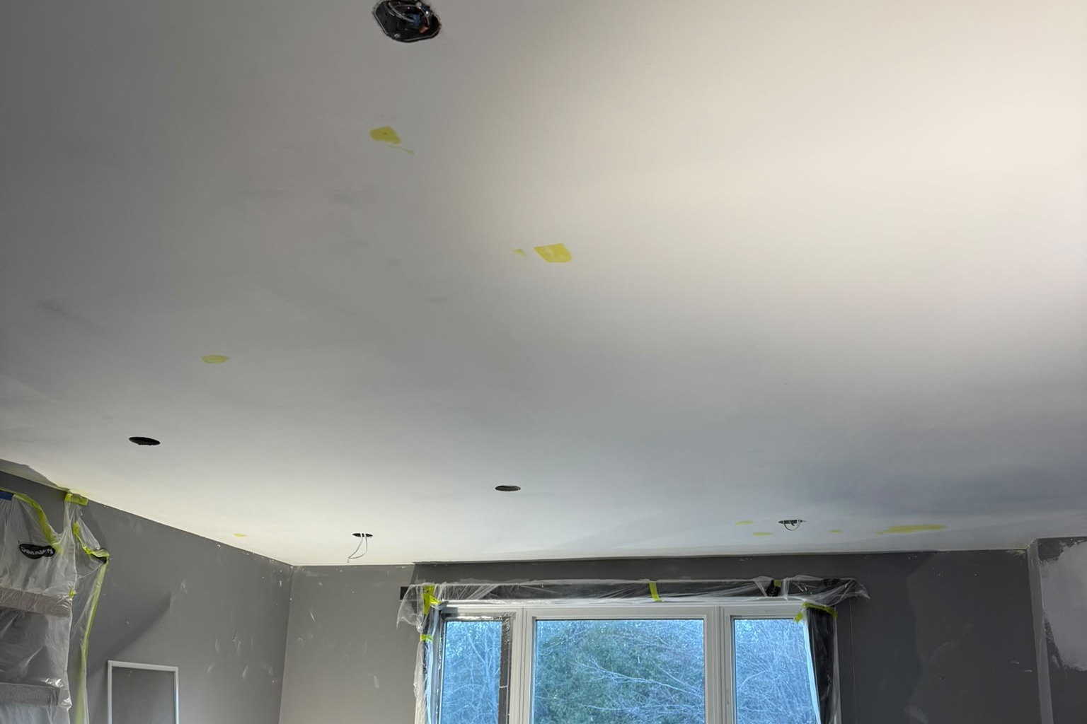 Ceiling paint prep with pot lights and masked window